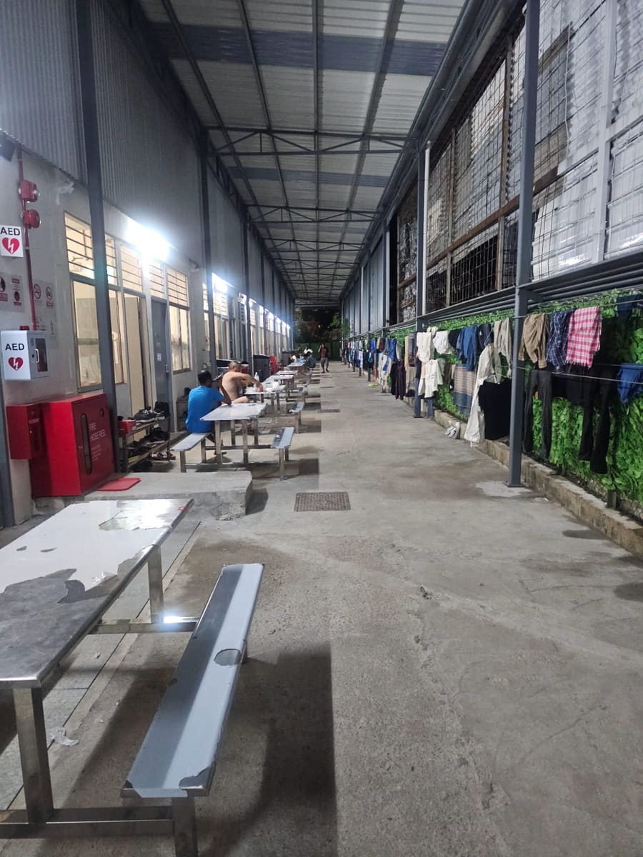 Covered common area with aed and fire safety — NextDorm31@Tuas dormitory in Tuas, Singapore